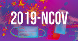 2019-NCOV theme with viruses, face mask and cleaning spray bottle