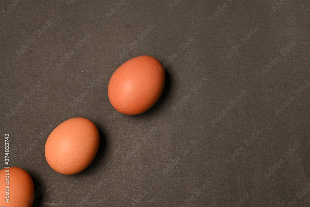 Three chicken eggs isolated on black background Three chicken eggs isolated on black background