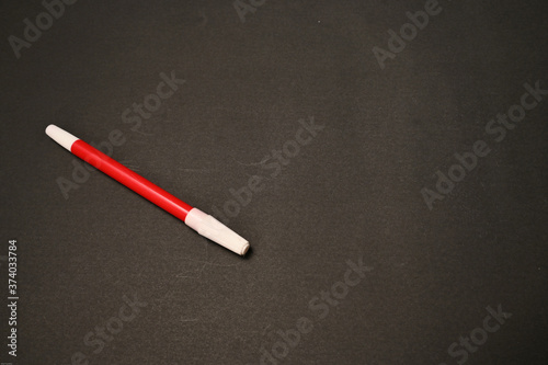 The red marker isolated on black background