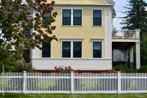 New England architecture with picket fence