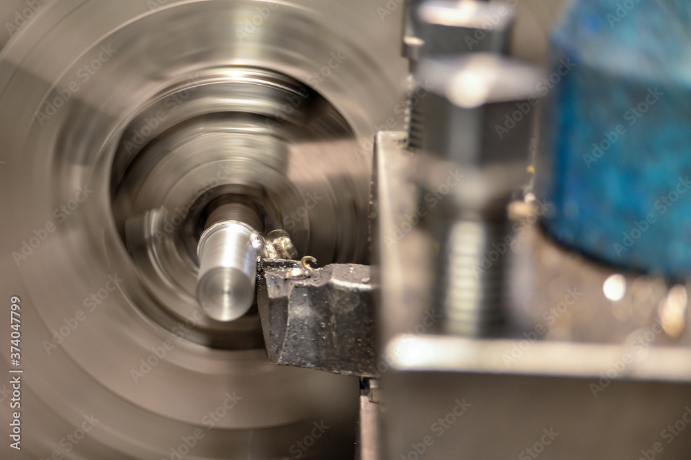 Working on a lathe, a cutter removes chips from the workpiece surface being processed. Working on a lathe, a cutter removes chips from the workpiece surface being processed.