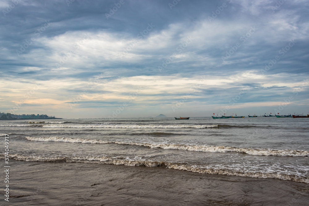 beach view with sea waves at early in the morning from low angle beach view with sea waves at early in the morning from low angle