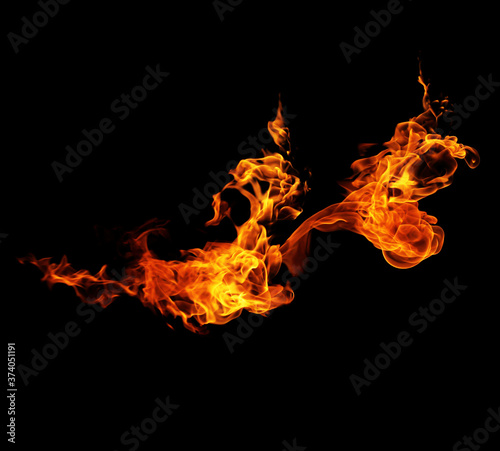 Fire burning flames on a black background © photodeedooo