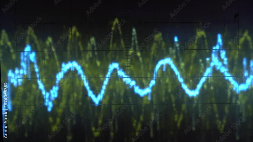 Audio signal on oscilloscope screen. Communication and electronics. Close up