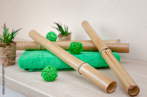 things for massage with bamboo sticks. Spa, wellness concept on bamboo background