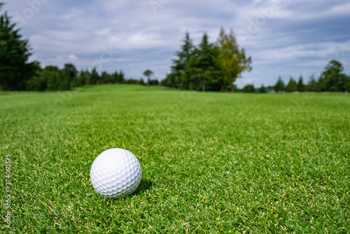 Golf Course with golf ball. Golf course with a rich green turf beautiful scenery.