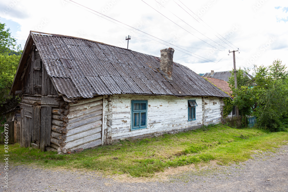 Old authentic wooden house in the Carpathian mountains, Transcarpathia, Ukraine.
