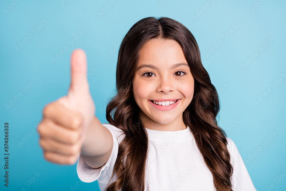 Close-up portrait of her she nice attractive confident cute cheerful cheery glad wavy-haired girl showing giving thumbup isolated on bright vivid shine vibrant blue teal turquoise color background Close-up portrait of her she nice attractive confident cute cheerful cheery glad wavy-haired girl showing giving thumbup isolated on bright vivid shine vibrant blue teal turquoise color background