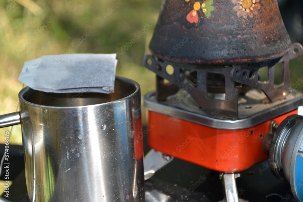 a mug for tea and a turk for coffee.
a mug for tea and a turk for coffee.