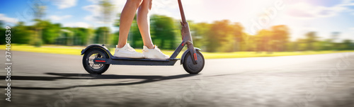 Photography Woman riding on scooter in park in summer