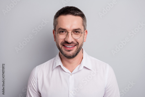 Close-up portrait of his he nice attractive cheerful cheery mature man scientist skilled experienced specialist expert shark wearing specs isolated over light gray pastel color background © deagreez