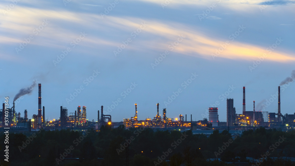 oil refinery lights against the sky