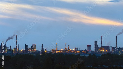 oil refinery lights against the sky