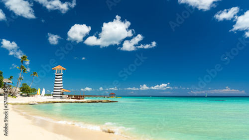 Lighthouse on the beach of the Caribbean, Dominican Republic, Bayahibe - Summer Vacation Concept photo