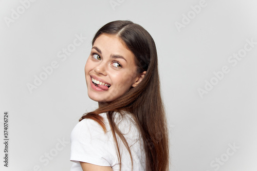 Wallpaper Mural Back view of happy brunette showing tongue and looking to the side Torontodigital.ca