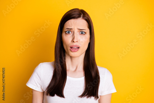 Close-up portrait of her she nice attractive nervous desperate terrified brown-haired girl worrying about fake news isolated over bright vivid shine vibrant yellow color background