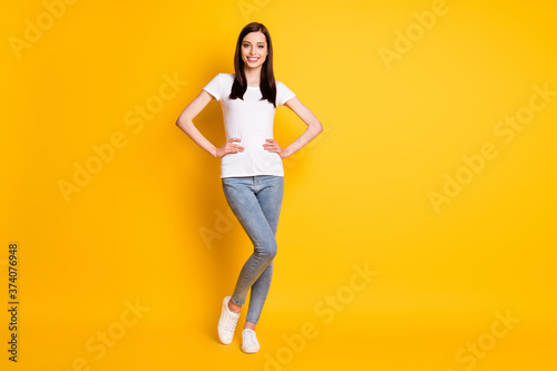 Fototapeta Naklejka Na Ścianę i Meble -  Full size photo of content nice sweet girl put hands waist enjoy weekend holiday wear casual style clothes white shoes isolated over shine color background