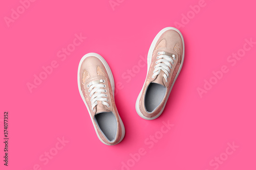 Stylish shoes on pink background, flat lay