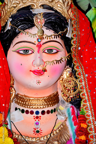 Sculpture of Hindu Goddess Durga, Goddess Durga idol with ornaments in close up side face view