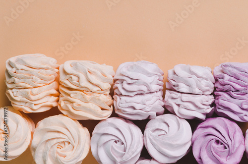colorful marshmallows on yellow background. Color sweet homemade zephyr or marshmallow. Flat lay. copy space