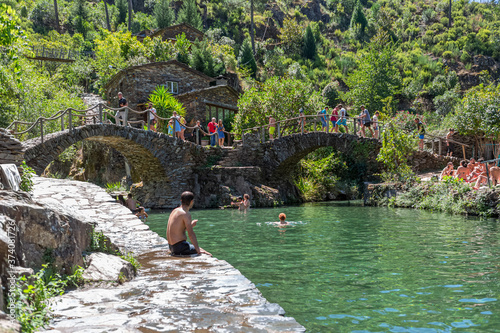 View of natural pools in the village of Piodao, the most typical and traditional village in Portugal, with schist houses and bridge over schist photo
