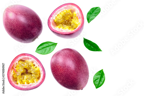 fresh passion fruits with leaves isolated on white background. exotic fruit. top view