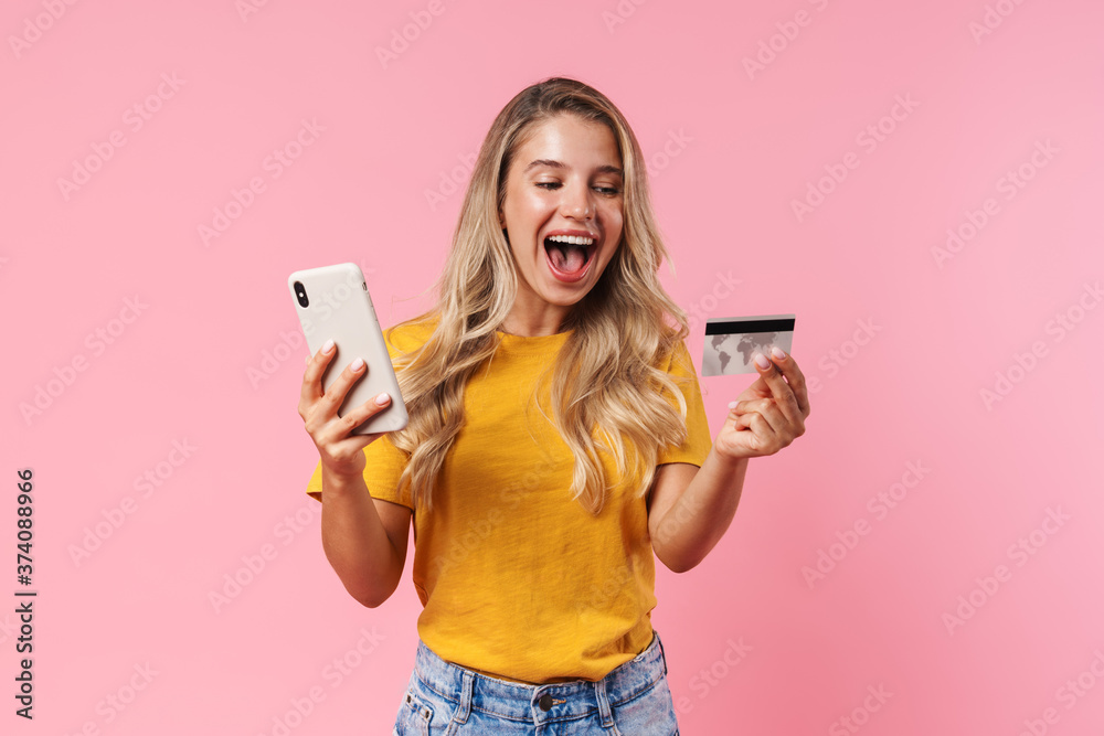 Cheery woman using mobile phone and holding credit card Cheery woman using mobile phone and holding credit card