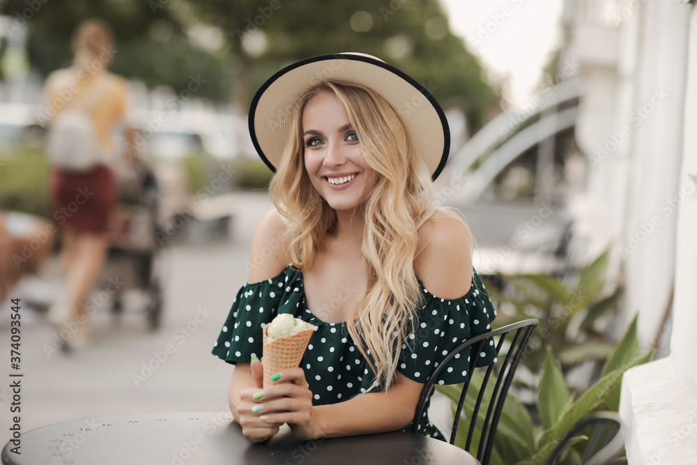 Beautiful smiling woman with ice cream outdoor, fashion portrait girl with hat