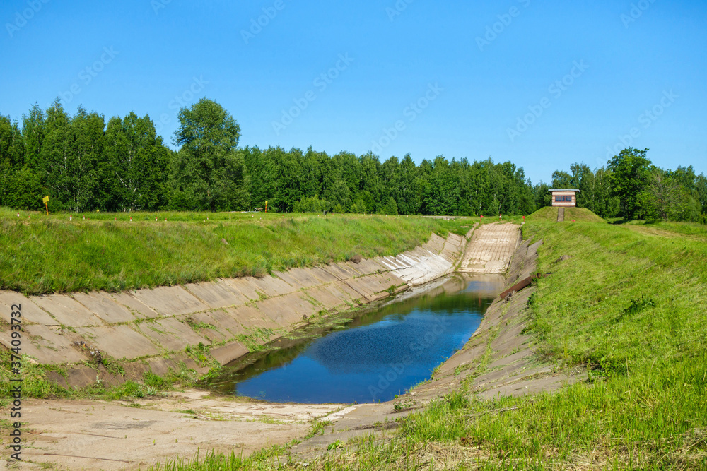 Training camp for battle tanks. The tank crew must work out the evacuation of the combat transport from the water. Commander post  is on the hill to the right