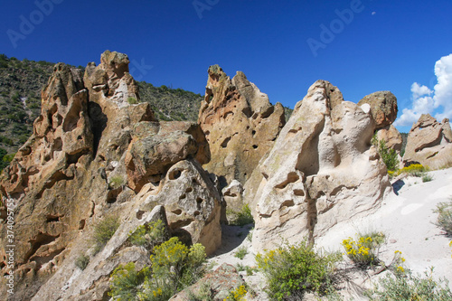 Rock formations at Bandelier National Monument where consolidated volcanic ash forms rock known as tuff. Frijoles Canyon, New Mexico, USA photo