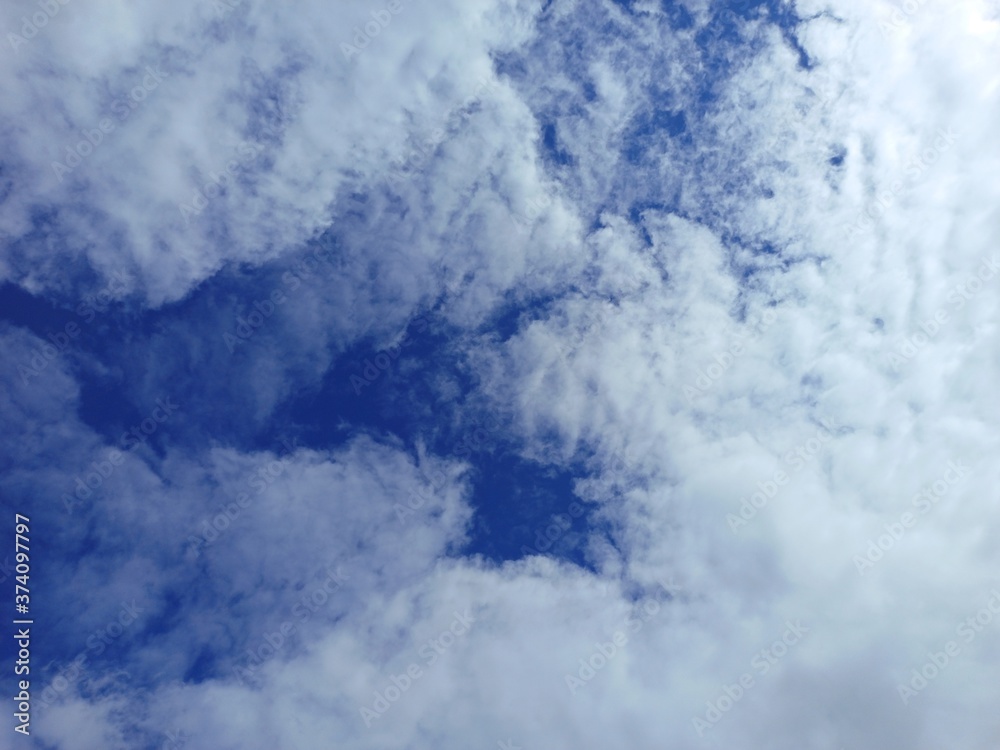 blue sky and white clouds. clouds against blue sky background. warm weather. spring has come	