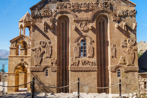 Bas-reliefs on eastern side of medieval Armenian Cathedral of Holy Cross, Akdamar island, Van Lake, Gevaş Turkey. Church is richly decorated by ornaments. It was built in 921 as church for kings photo