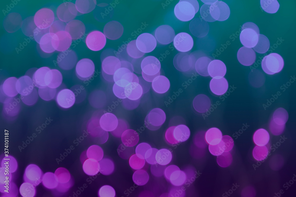 Multi-colored defocused background with lantern lights and garlands. Bokeh and blur effect. Defocused. Christmas, New year and other holliday mood. Multi-colored defocused background with lantern lights and garlands. Bokeh and blur effect. Defocused. Christmas, New year and other holliday mood.