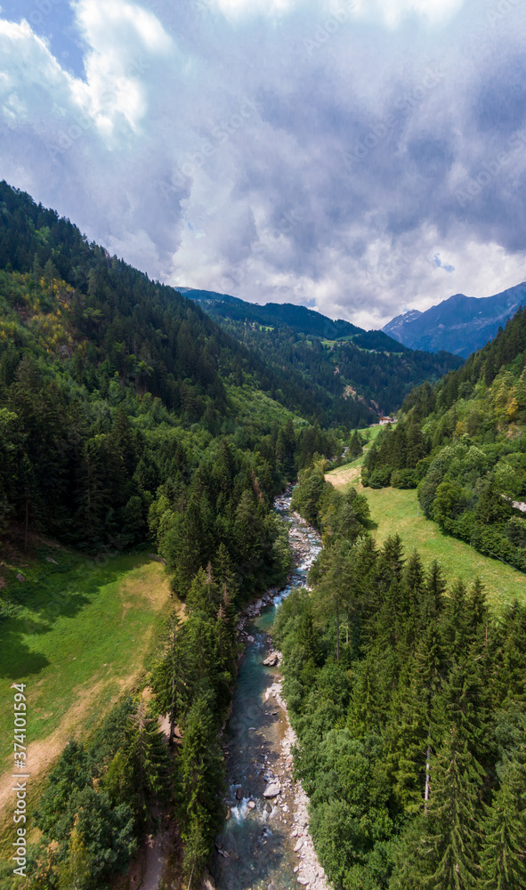 Alpine scenery in Passeier valley near Moos in South Tyrol, North Italy during the summer. Wild river flow in the dolomites.