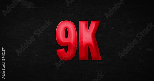 9K, 9000. Glossy red word is zoomed into focus. Text intro/opener on black background. 4K animation photo