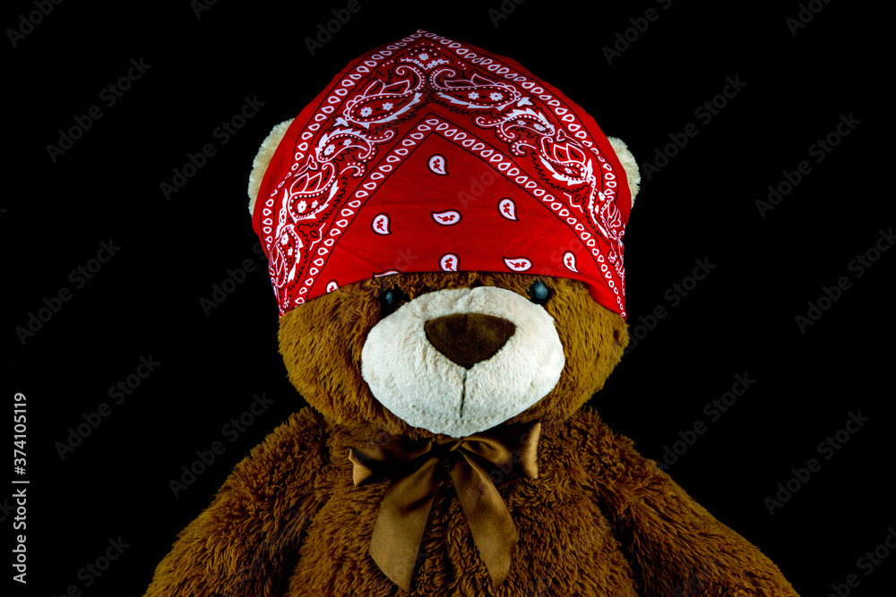 Teddy Bear With a Red Bandana on Head on a Black Background Stock Photo |  Adobe Stock