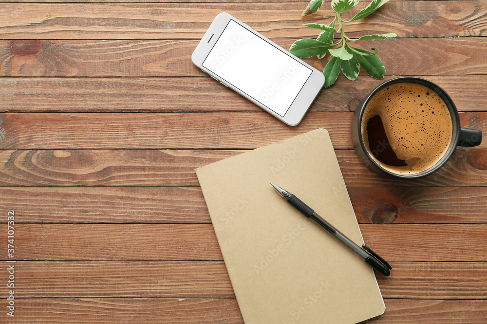 Notebook with pen, mobile phone and cup of coffee on wooden background Notebook with pen, mobile phone and cup of coffee on wooden background