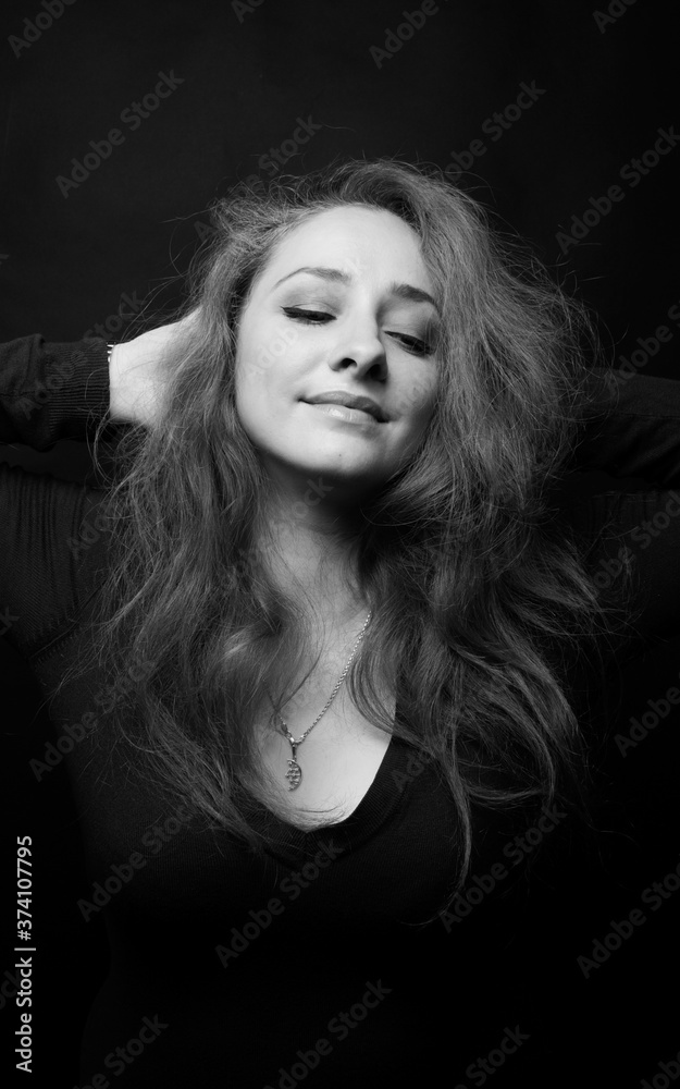 The beautiful smiling woman closeup in the studio The beautiful smiling woman closeup in the studio