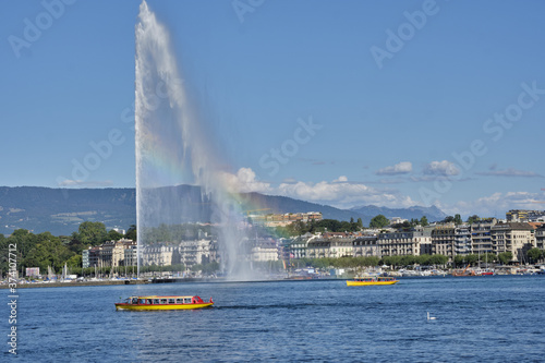 the water jet fountain and the famous yellow boats on, lake geneva, switzerland.