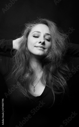 The beautiful smiling woman closeup in the studio
