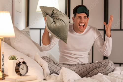 Stressed man suffering from...