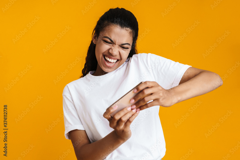 Cheerful young african woman playing games Cheerful young african woman playing games