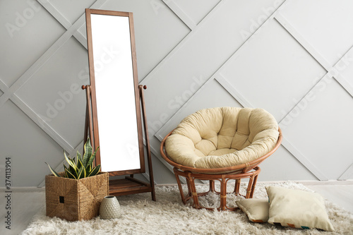 Big mirror with armchair ne...