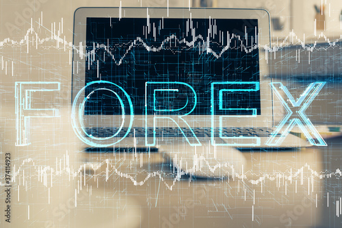 Double exposure of forex graph and work space with computer. Concept of international online trading.