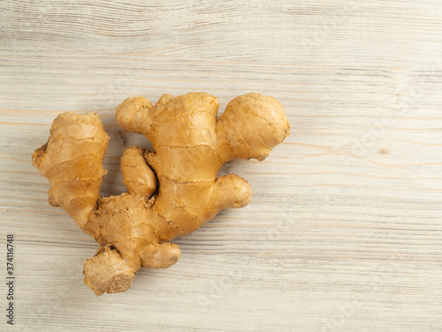 ginger on the table on the left, flat lay, copy space, horizontal orientation, beige, closeup