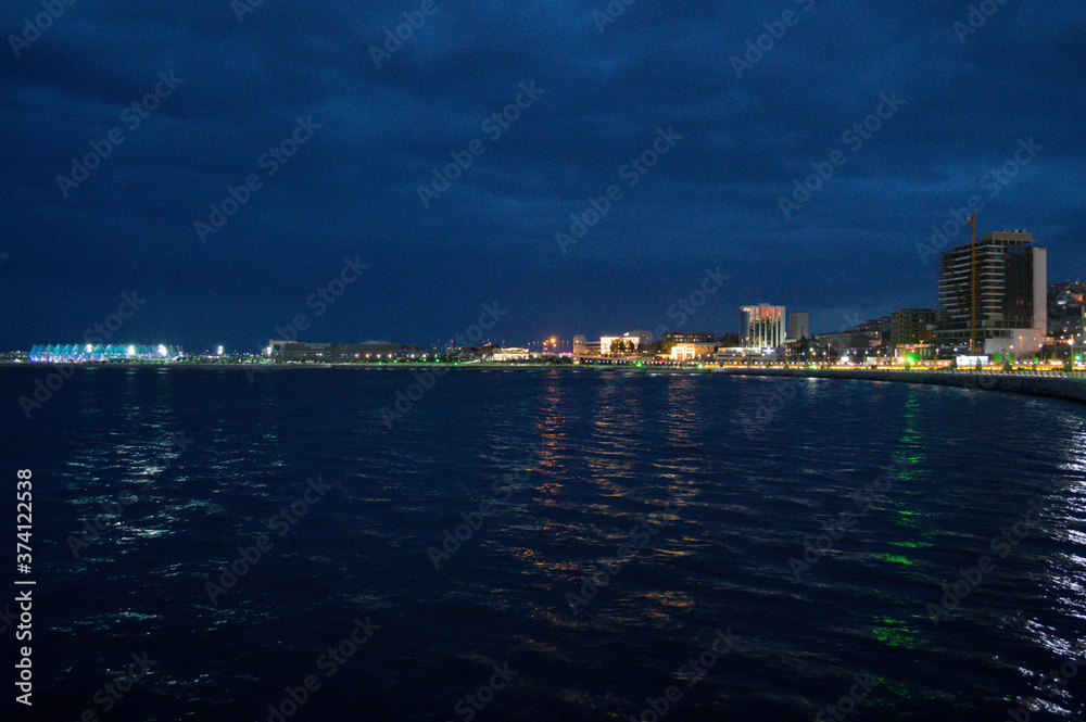 Illuminated Chrystal Hall, Promenade and Caspian Sea in Baku, Azerbaijan