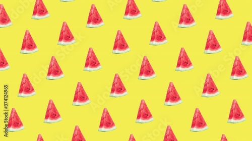 seamless pattern with many red ripe watermelon slices animated on a yellow background. realistic 3d food. advertising concept with copy space

