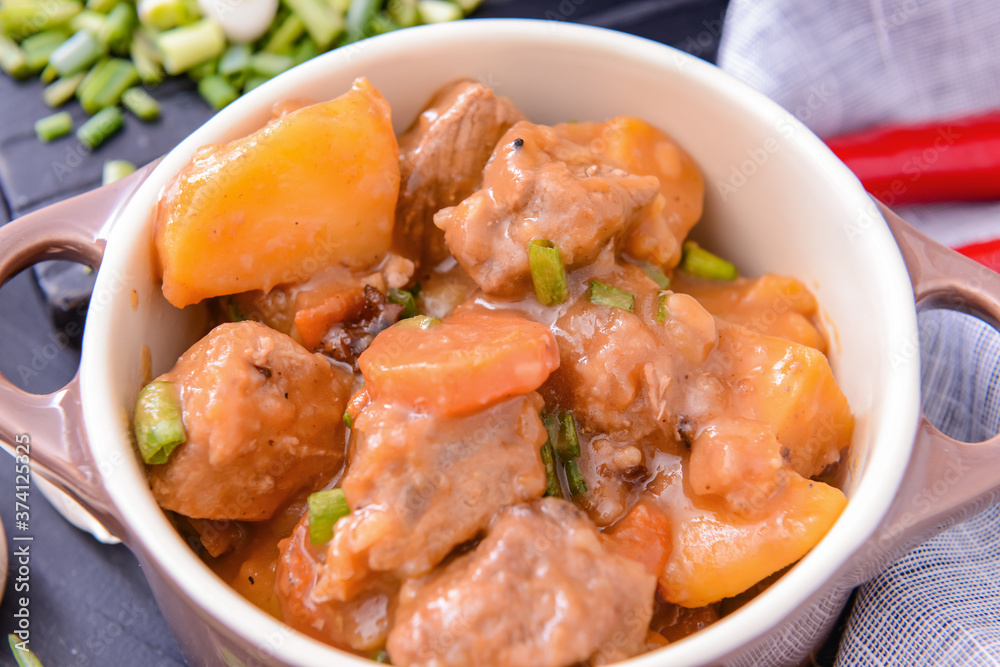 Tasty beef stew in pot, closeup Tasty beef stew in pot, closeup