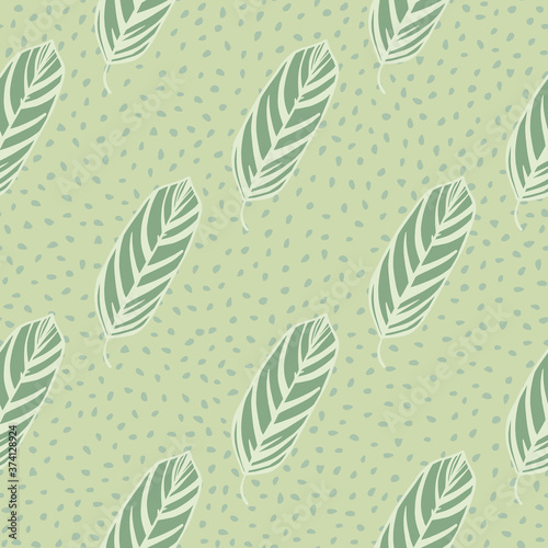 Pale botanic seamless pattern with leaves outline silhouettes. Green ornament with white contour on dotted background.