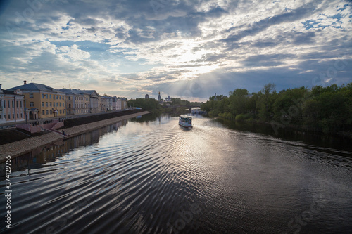 Summer townscape with motor ship on a river © Дэн Едрышов